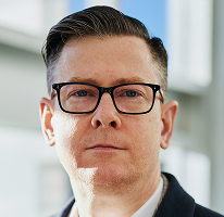 Photo d'Alexander Hughes, dirigeant d'une entreprise de négociation de cryptomonnaies